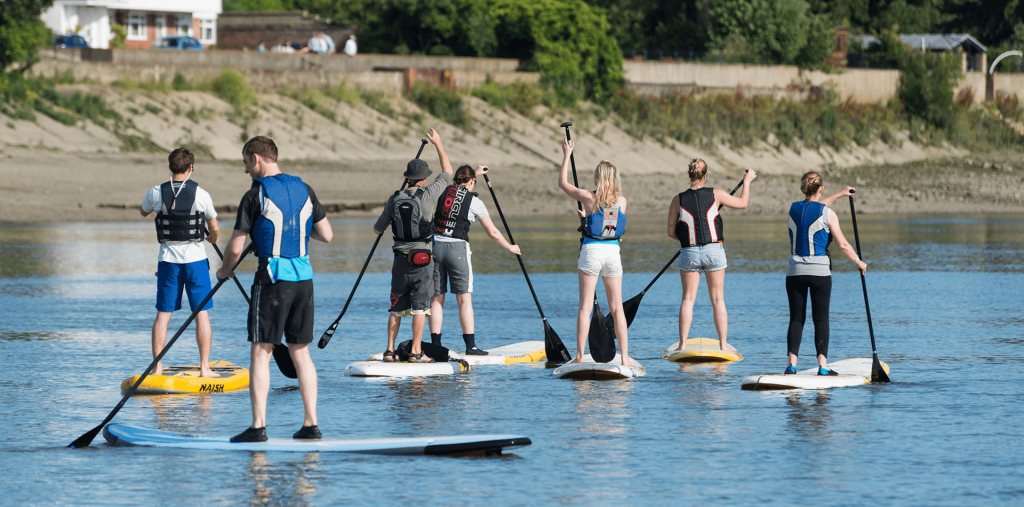 Stand up paddleboarders on the tidal River Thames